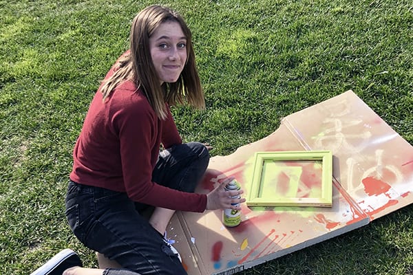 a grauer student working on her art project