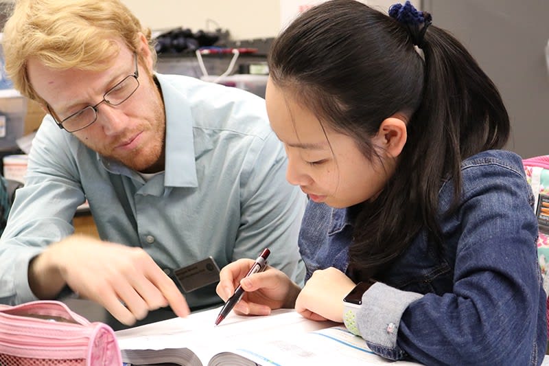 a teacher helping a student