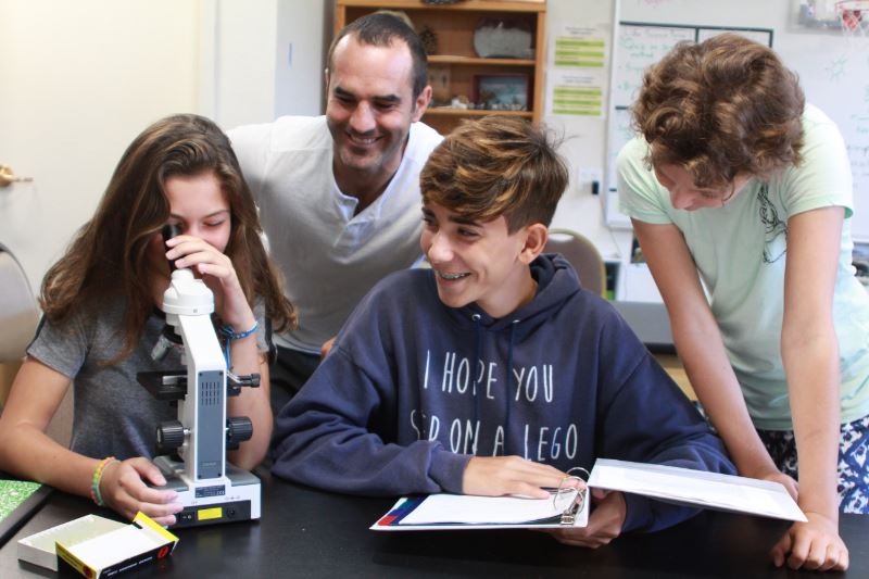 a small group of students doing a science experiment