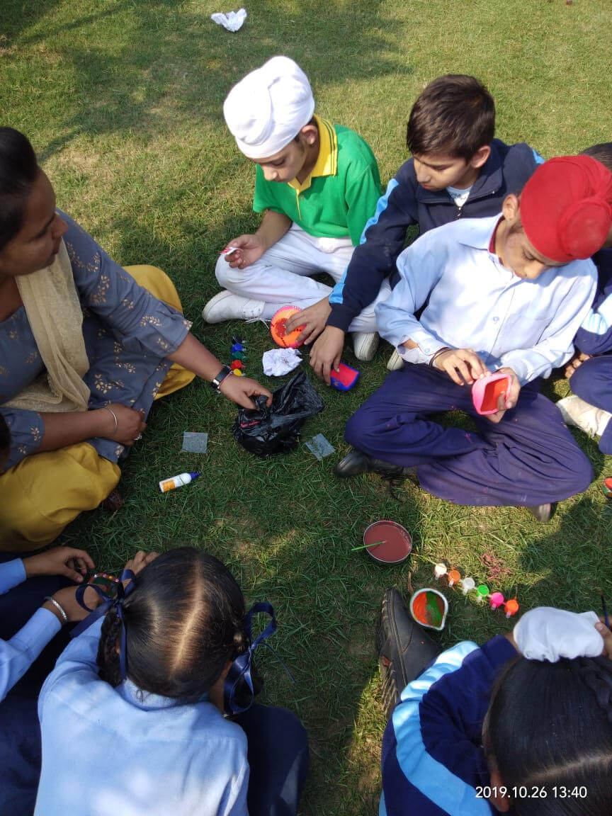 brainsters students doing craft work outside