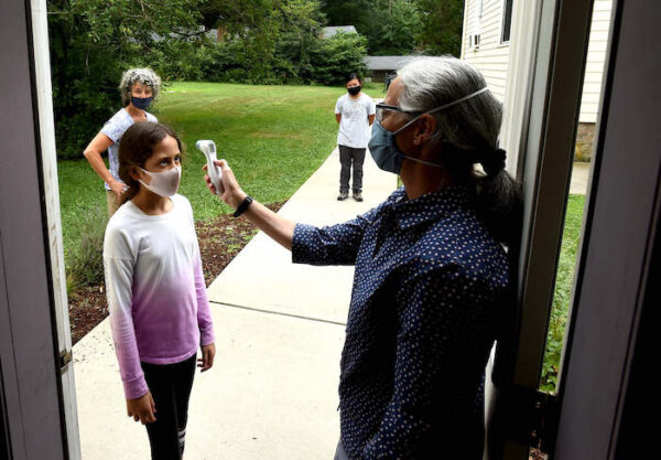 students having their temperatures checked at CELC middle school in branford Connecticut