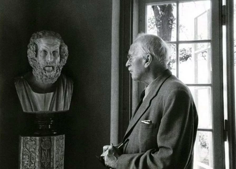 Carl Jung contemplating the bust of Socrates