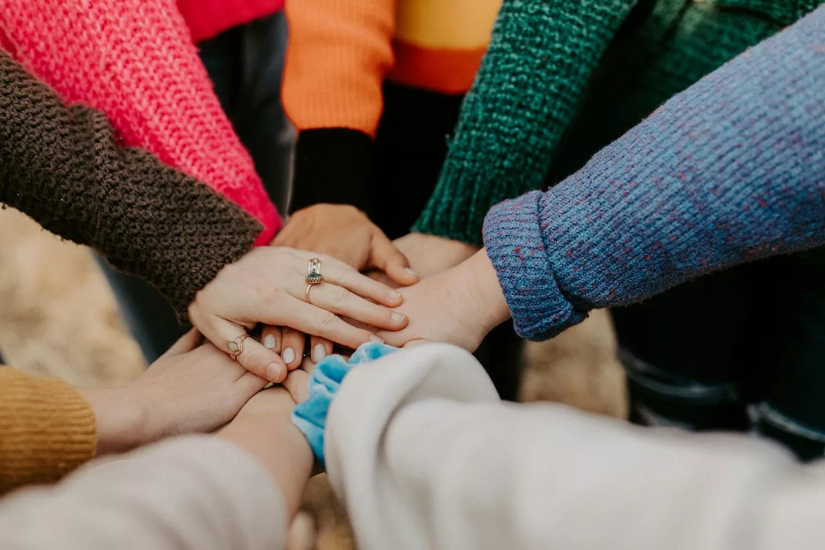 Hands stacked to show teamwork