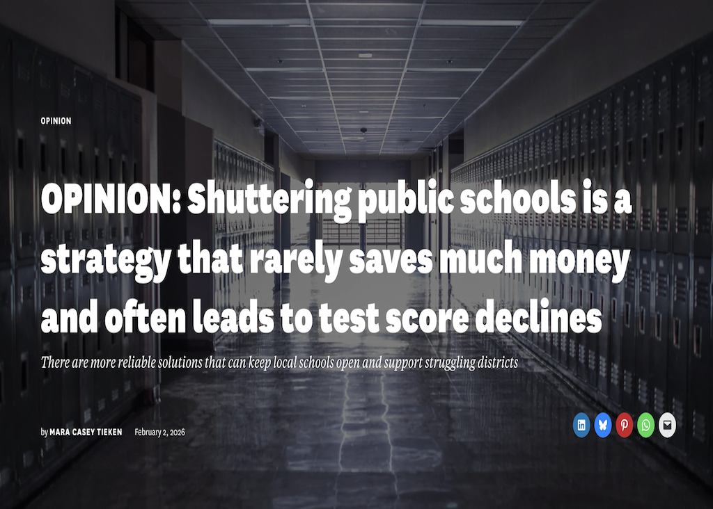 A paper sign with painted handprints with text that reads "2 schools 1 family"